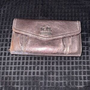 The Coach Women's Leather Wallet.